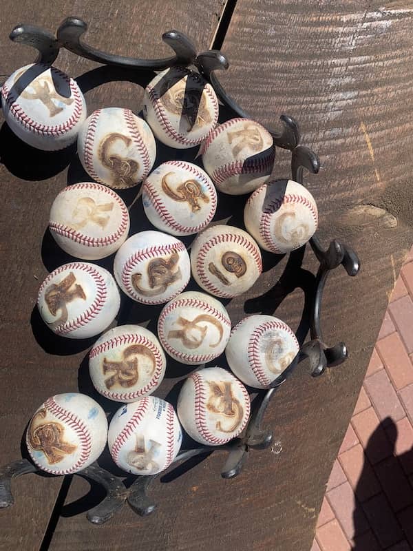 C Lazy U Ranch -  branding baseballs at MLB Colorado Rockies