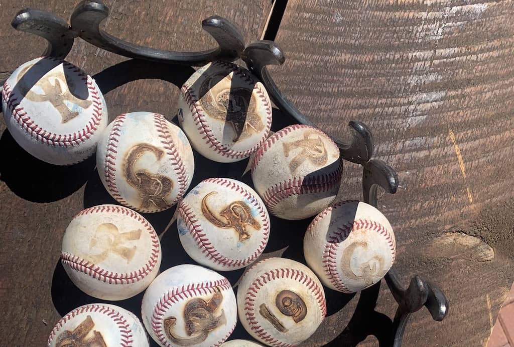 C Lazy U Ranch - branding baseballs at MLB Colorado Rockies
